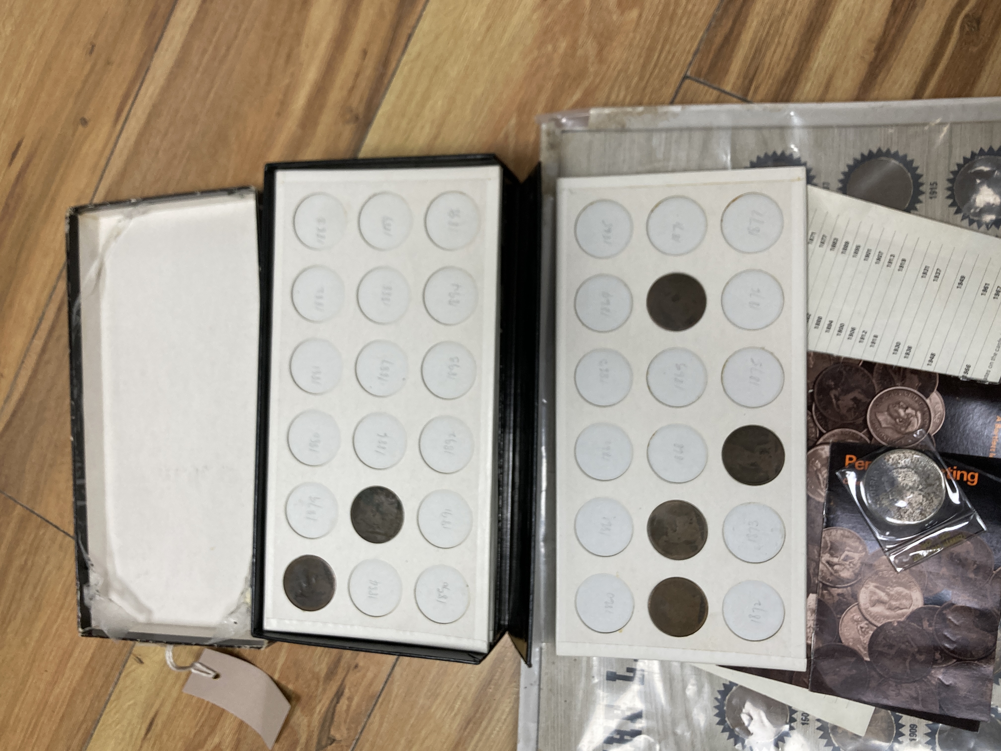 A collection of Victorian and later pennies, including a mounted display, 'The Last of the Big Pennies'